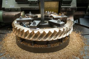 Bronze worm gear wheel in lathe in engineering factory
